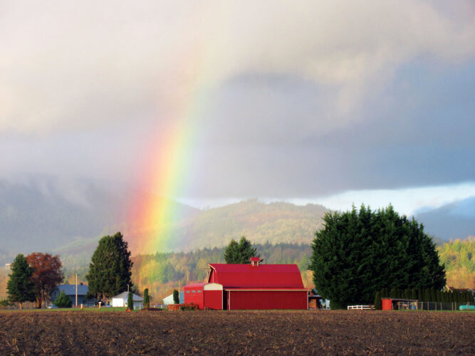 Photos from the Field: Rainbow Arcs Over Bright-Red Barn